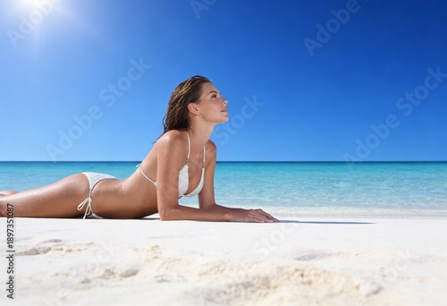 Woman on the beach in white bikini