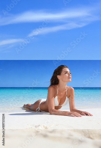 Woman on the beach in white bikini