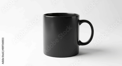 A sleek, black ceramic coffee mug stands upright on a clean white surface with subtle shadows