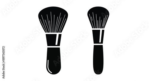 Two makeup brushes depicted in a striking black silhouette