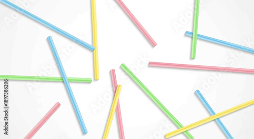 Vibrant blue, yellow, green, and pink drinking straws scattered randomly across a clean white surface
