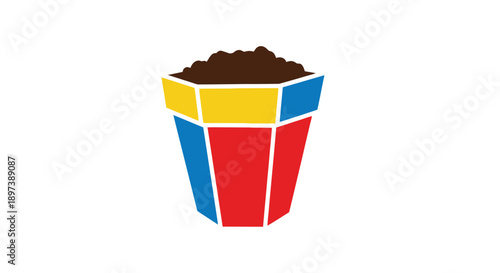 Colorful geometric bucket overflowing with dark brown granular material