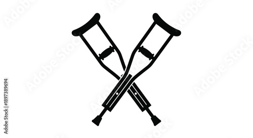 A pair of black crutches crossed against a plain white background