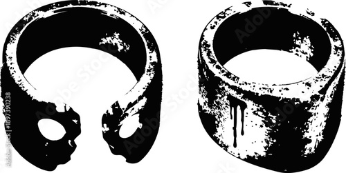 Two worn industrial metal rings with chipped and scratched surface textures