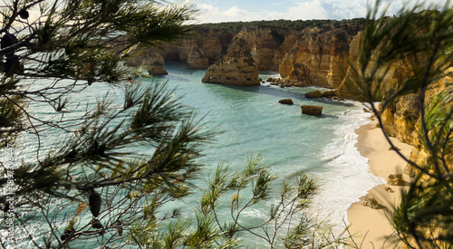 Pau Beach (Praia do Pau) is just east of the renowned Marinha Beach and is only accessible by sea as it is surrounded by coastal cliffs.