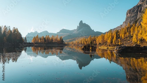 Alpine landscape of Lago di Federa with Croda da lago mountain and yellow larch forest in autumn at Dolomites, Italy