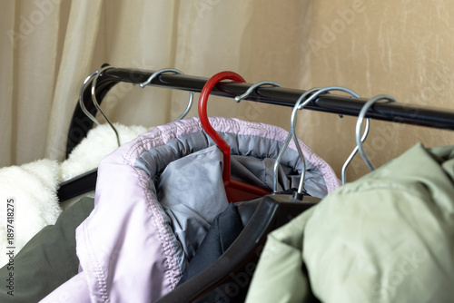 Foto Clothes hang on a hanger in the dressing room.
