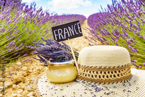 Jar with honey at lavender field. Holidays in France.