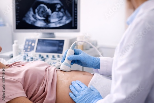 Wallpaper Mural Doctor performing an ultrasound scan on a pregnant woman during a routine prenatal examination in a medical clinic. Torontodigital.ca