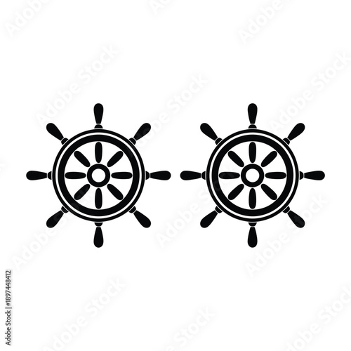 Two black ship wheels are prominently displayed against a white background