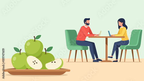 Two people work on laptops at a table with green apples in foreground