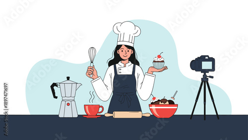 Professional female chef in a white uniform and hat presenting cupcakes and desserts while filming a cooking tutorial for a video blog.