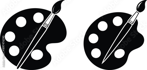 Two black paint palettes with paintbrushes on white background for art and design