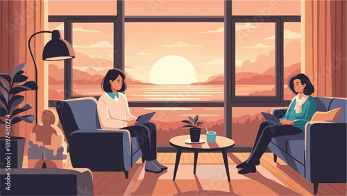 Two women relax on sofas working on laptops with sunset view