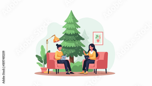 Two women sit in armchairs, using laptops near a potted plant and a large evergreen tree