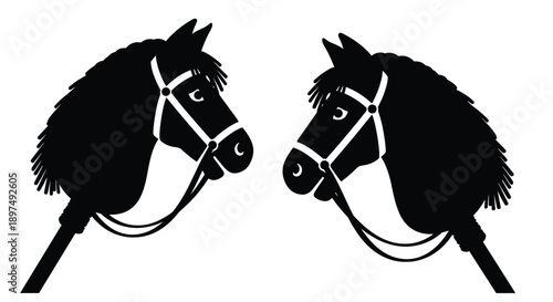 Black silhouette of two hobby horse heads with bridles facing each other isolated on a plain white background for design.