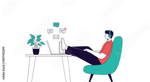 Man relaxing in a teal armchair with his feet up on a desk while working on a laptop and listening to music with headphones.