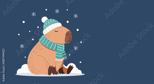Adorable illustration of a capybara wearing a knitted hat and scarf sitting in the snow during a winter snowfall on a dark blue background scene.