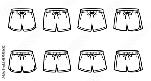 Collection of eight black and white shorts on dark background
