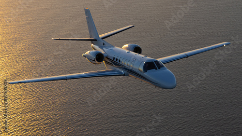 Business jet (Citation Encore ) in beautiful light sunset light, over the Pacific Ocean