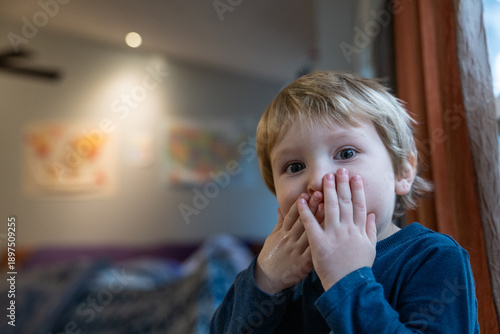 Tableau sur toile Toddler boy staring at camera with a runny nose