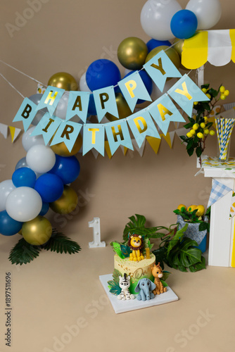 Jungle Safari First Birthday Party Setup with Animal Cake and Balloons