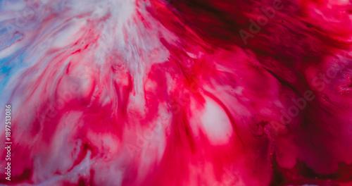 Ink flow defocused. Watercolor drop. Red black wave pigment spill on white liquid background. Art dye abstract dissolving in color emulsion.