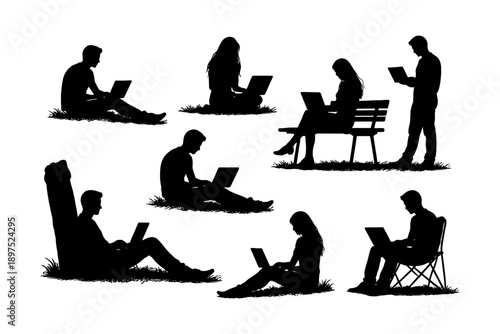 Silhouette group of adults working outdoors on laptops.