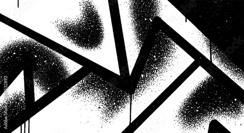 Abstract black and white spray paint lines and splatters on a white background.