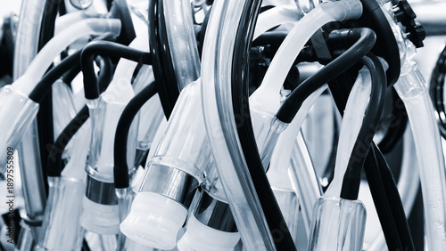 Quadro su tela Attached to the machine are a series of tubes with red and white stripes