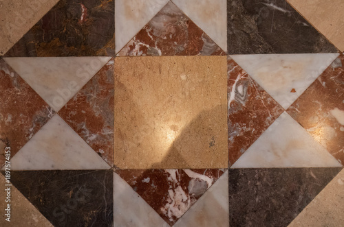 Geometric marble tile pattern on church floor