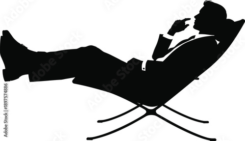 Black Silhouette of a Businessman Relaxing in a Lounge Chair Thinking and Contemplating Success in a Modern Minimalist Office Setting