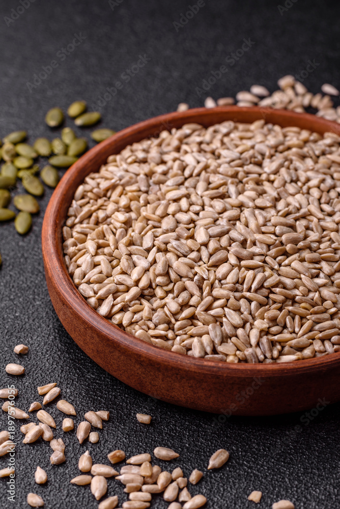 Fototapeta premium Shelled sunflower seed kernels, salted, roasted, or raw, are a healthy ingredient. Sunflower seeds