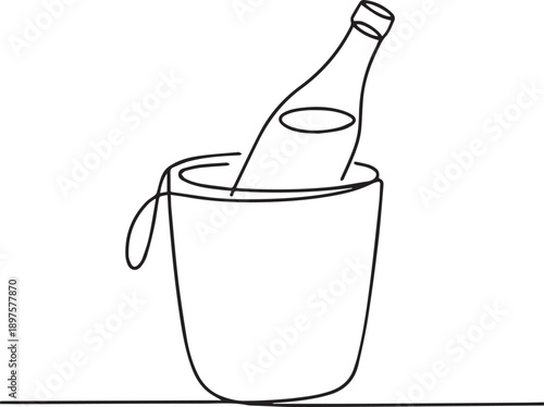 Chilled bottle in an ice bucket on a table viewed from the side