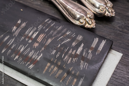 Tableau sur toile Testing gold and silver using touchstone and acid reagents