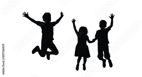 Three children joyfully jumping in the air a dark silhouette