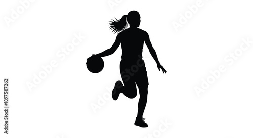 A female basketball player dribbling captured in dynamic motion silhouette