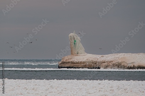 Frozen ice formation on lakeshore breakwater