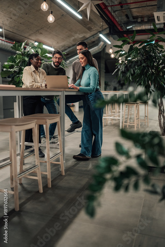 Wallpaper Mural Diverse business team collaborating using laptop in office Torontodigital.ca