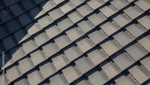 Textured Rooftop Shingles Under Sunlight Showing Depth And Shadow Patterns