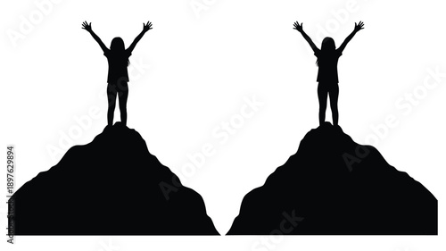 Two figures with arms raised on peaks a striking silhouette
