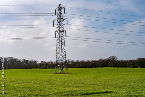 Electric pylon in an arable agricultural field in the countryside