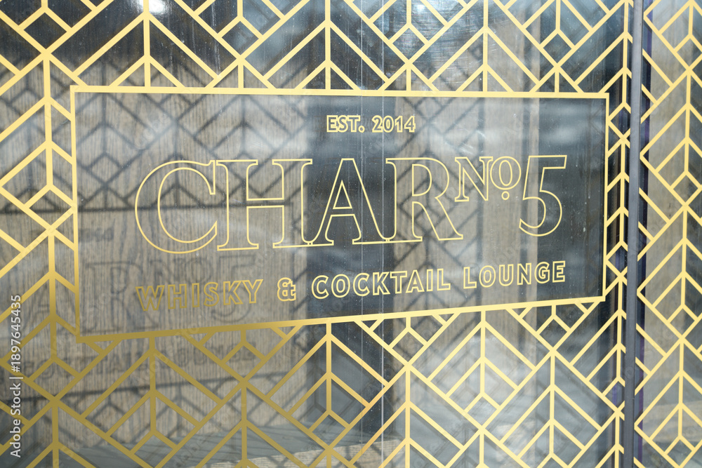 Fototapeta premium Art Deco inspired window graphic sign for Char No.5 Whisky & Cocktail Lounge inside Delta Hotel at 75 Lower Simcoe St, Toronto