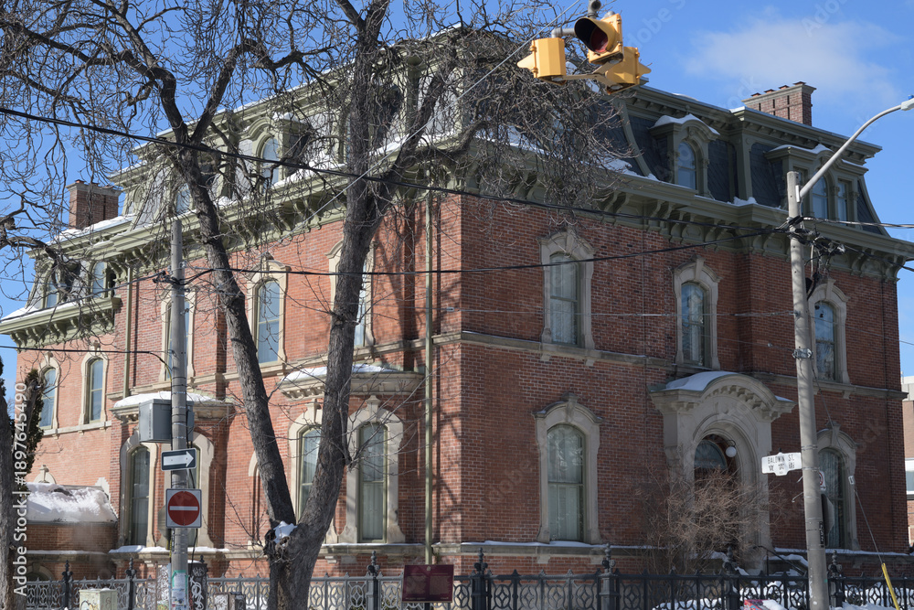 Fototapeta premium southeast corner view of George Brown House, built 1876, in Second Empire style, at 186 Beverley St, Toronto