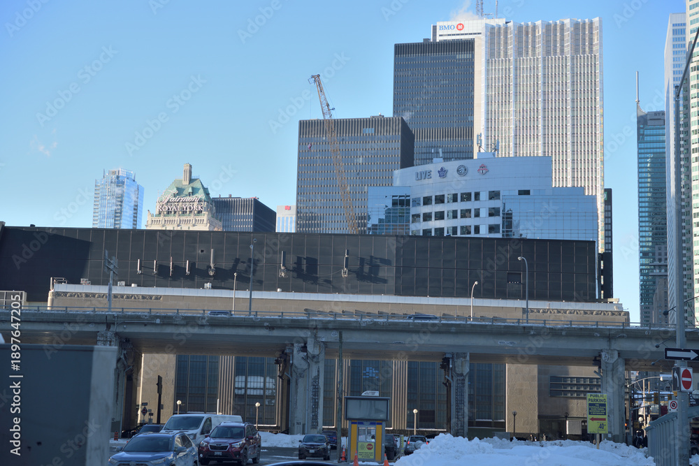 Fototapeta premium looking north from Harbour St west of Bay St to elevated Gardiner Expressway, Scotiabank Arena, and towers in the financial district, Toronto