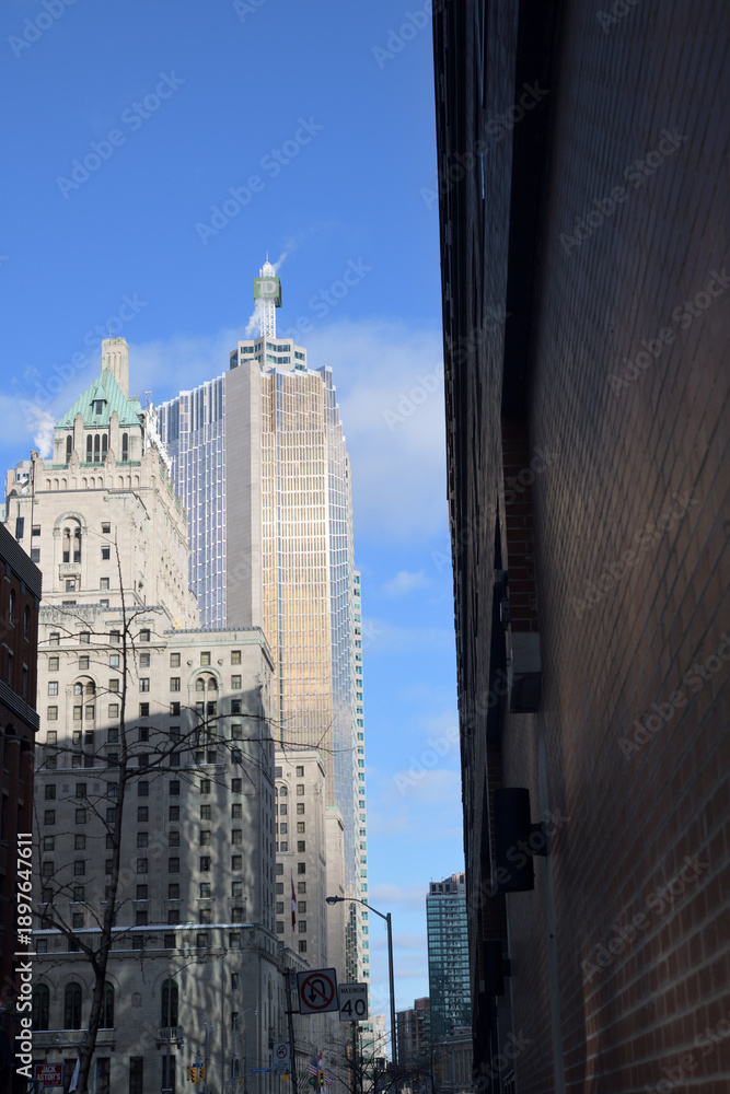 Fototapeta premium looking east on Front St W to Fairmont Royal York hotel and Royal Bank Plaza, south tower, at Bay St, Toronto