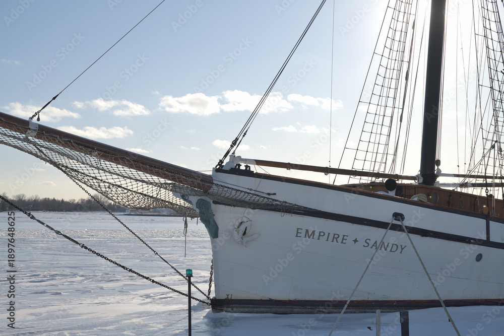 Fototapeta premium The Empire Sandy, a large passenger sailing ship, moored in Toronto Harbor in winter