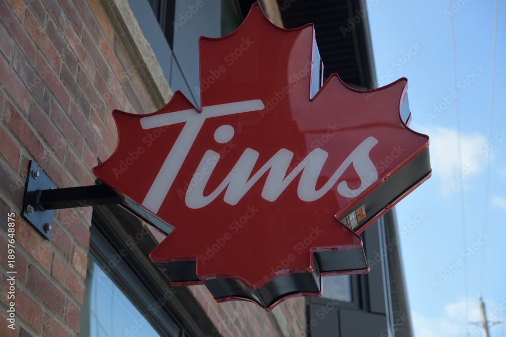 Obraz premium close-up of projecting maple leaf sign outside Tim Hortons, a coffee shop, located at 408 Roncesvalles Av, at Howard Park Av, Toronto