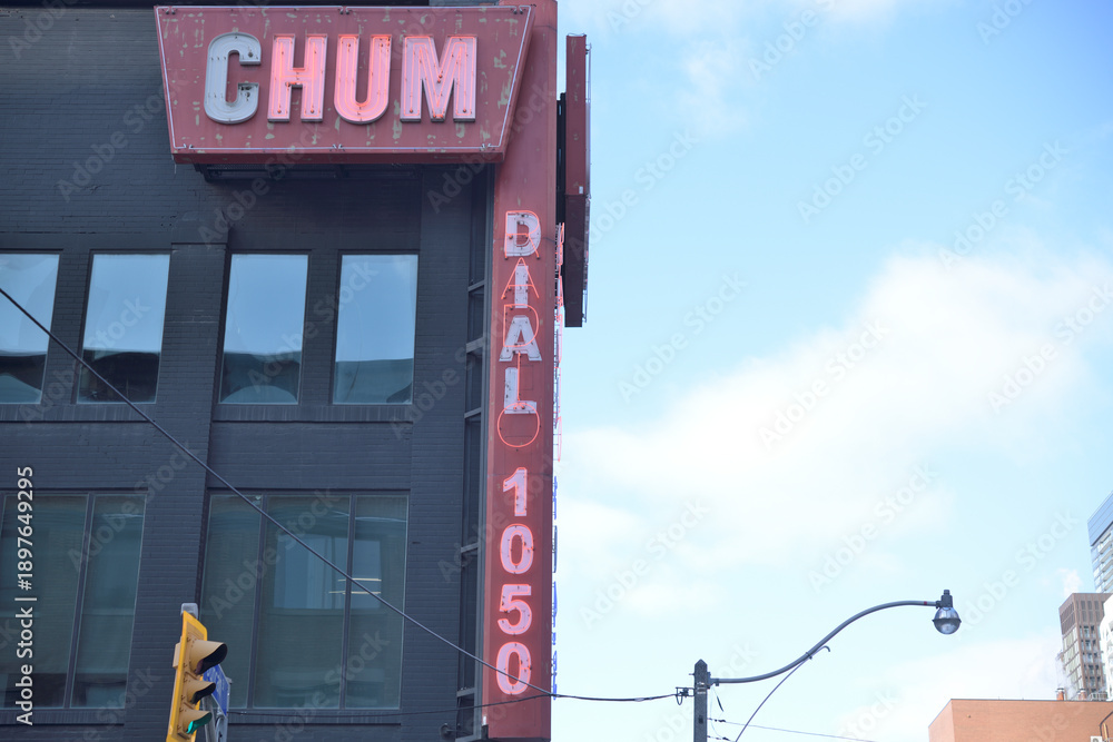 Fototapeta premium vintage sign of CHUM 104.5, a radio broadcaster, located at 299 Queen St W, Toronto (actually at Richmond St W and Duncan St)