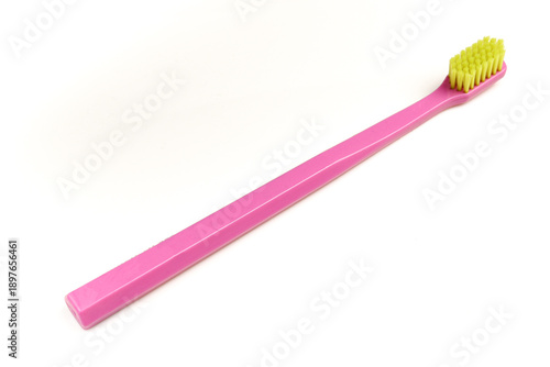 Pink toothbrush isolated on white background